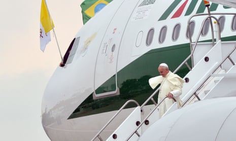 Pope Francis leaves the plane upon arrival in Rio de Janeiro