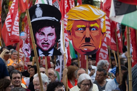 Cardboard cutouts depicting Milei and Trump