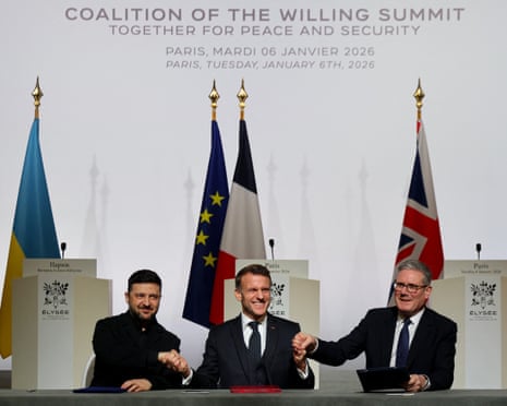 Ukraine's President Volodymyr Zelenskyy, France's President Emmanuel Macron and Britain's prime minister Keir Starmer shake hands upon the signing of the declaration on deploying post-ceasefire force in Ukraine during the Coalition of the Willing summit on security guarantees for Ukraine, at the Élysée Palace in Paris.