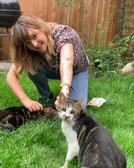 Rebecca Goodman at home with her cats Oscar and Dennis