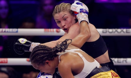Lauren Price plants a punch on Natasha Jonas