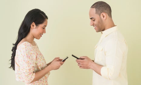 Young couple sending messages