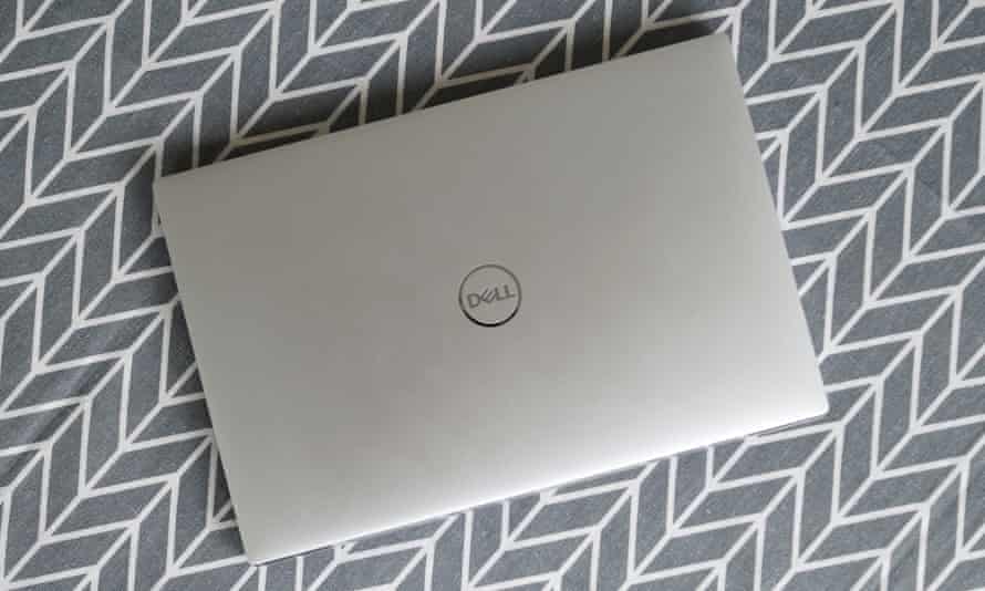 The lid is smooth aluminium with a chromed Dell logo in the centre