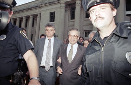 Jim Bakker leaves court with lawyers and officers