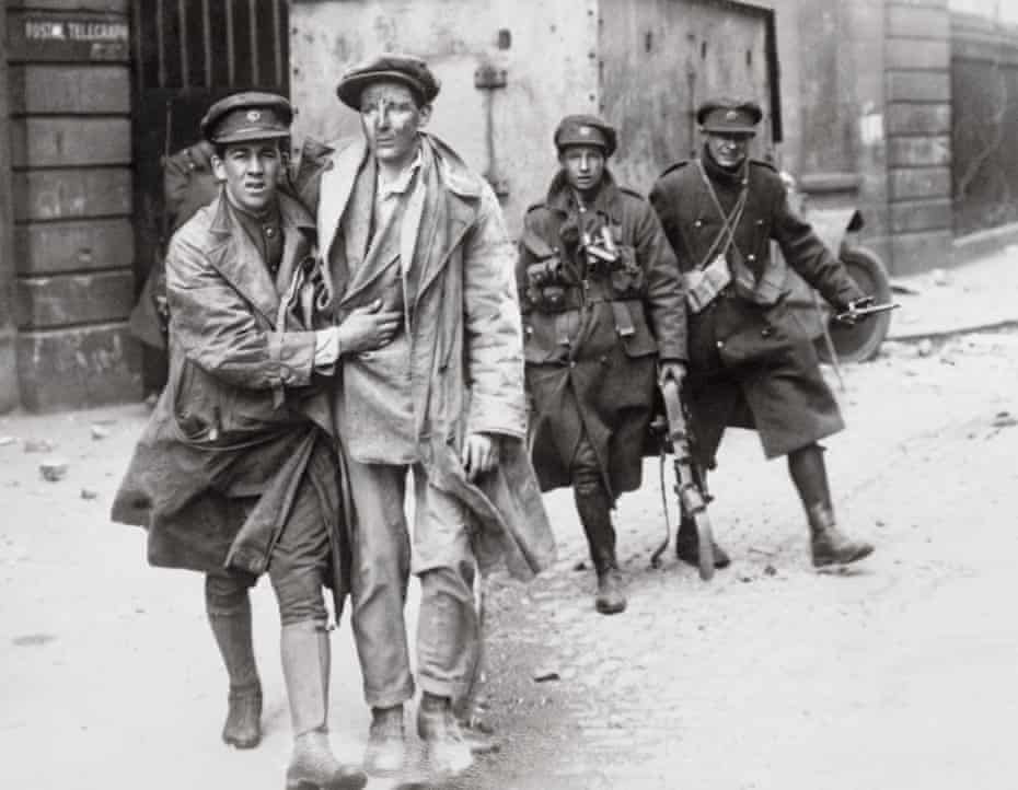 Soldier Helping an Injured Man