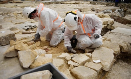 Archaeologists excavate the floor of Notre Dame Cathedral.