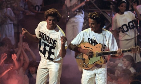 Wham (George Michael and Andrew Ridgeley) performing in 1984 with slogan T-shirts.