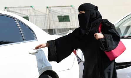 Saudi woman getting in car