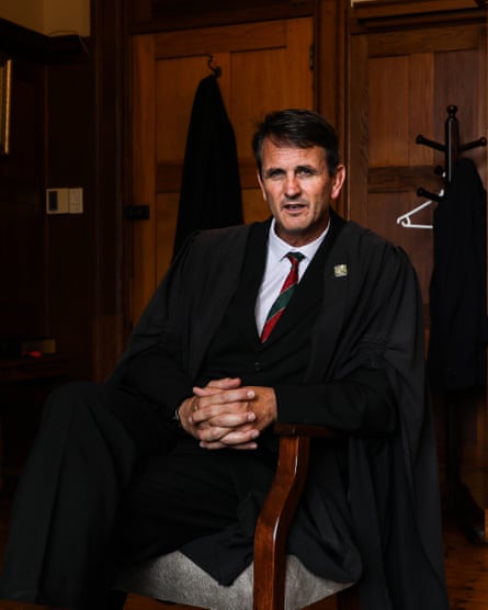 Gregary Hassenkamp seated with hands clasped