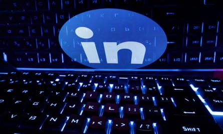 A keyboard in front of a displayed LinkedIn logo