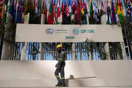 A worker sets up at the COP28 UN climate summit on Thursday morning.