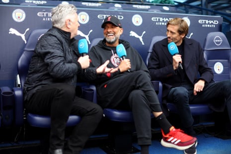 Liverpool manager Jürgen Klopp is interviewed by BT Sport presenter Des Kelly and pundit Peter Crouch before the match against Manchester City.