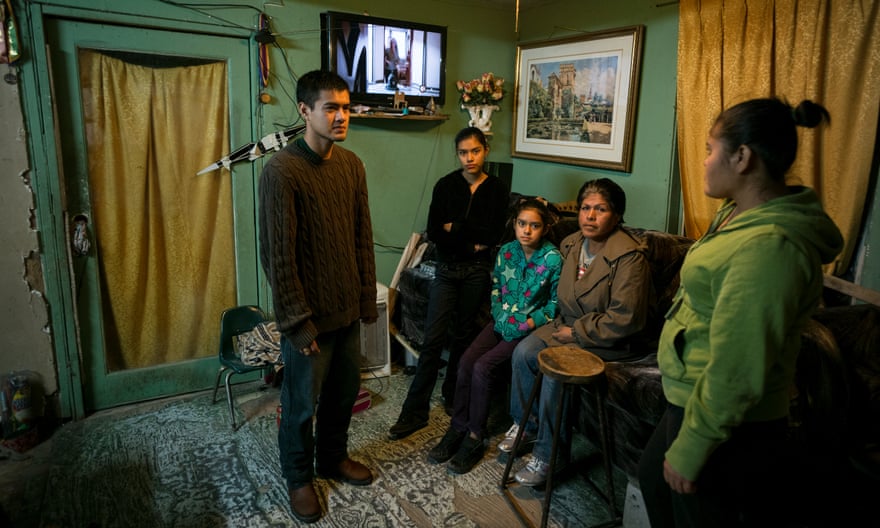 The Cardenas family are photographed in their home
