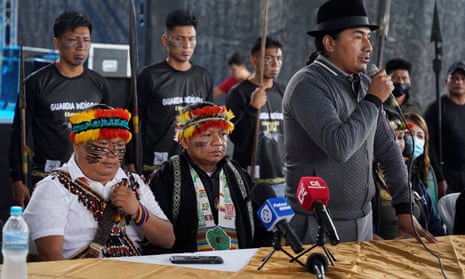 Indigenous leaders with one speaking in mic