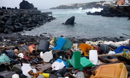 A coastal area of the Azores islands in Portugal is shown littered with plastic garbage.