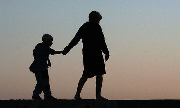 Silhouette of a mother and a child in the evening