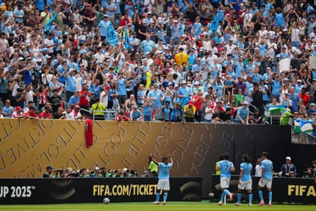 Manchester City players and fans celebrate a goal during the Club World Cup game against Wydad.