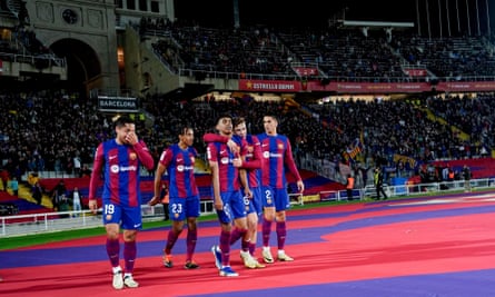 Lamine Yamal (centre) celebrates with his teammates after scoring the La Liga match between Barcelona and Mallorca at the Estadi Olímpic in Barcelona, Spain on 8 March 2024