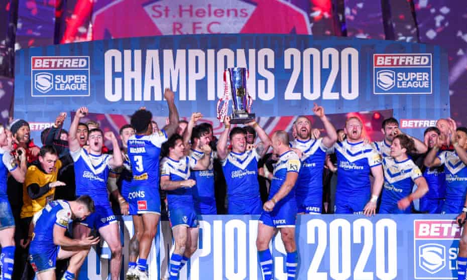 St Helens players celebrate with the Super League trophy.