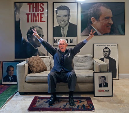 Roger Stone, pictured at his office in Fort Lauderdale, Florida, giving a very Nixonian salute.