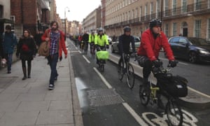 Commuters cycling in London