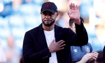 Burnley manager Vincent Kompany waves to fans.