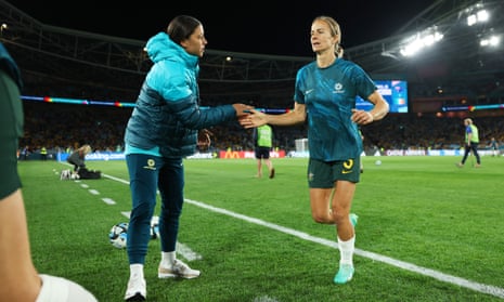 Injured Sam Kerr of Australia high fives with Aivi Luik.