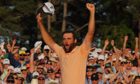Scottie Scheffler celebrates on the 18th green after winning the Masters.