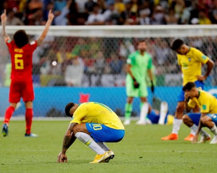 Neymar crouches down in dejection after the 2022 World Cup quarter-final match between Brazil and Belgium