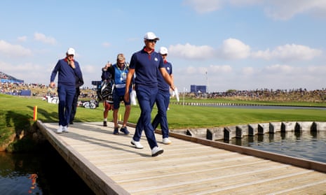 Henrik Stenson and Justin Rose cross a bridge during their 3&amp;2 win over Dustin Johnson and Rickie Fowler.
