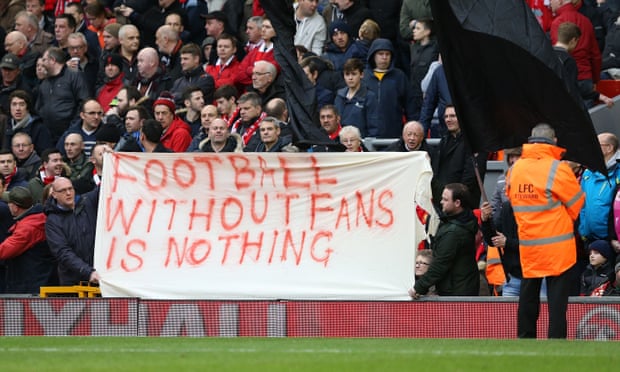 Liverpool fans hold up banners protesting at the proposed season ticket prices.