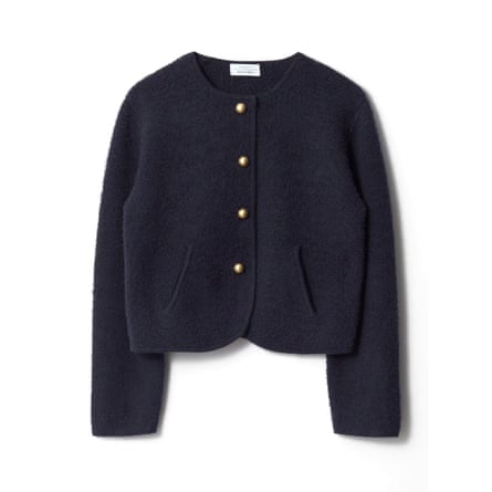 A navy cardigan with gold buttons on a white background