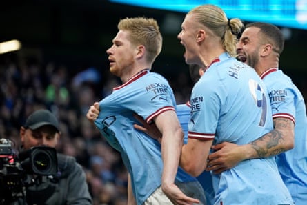 De Bruyne celebrates with Erling Haaland and Kyle Walker, right, after scoring City’s first goal against Arsenal in 2023 to turn the Premier League title race their way.