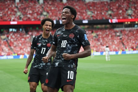 Jonathan David reacts aft scoring 1 of his 3 goals for Canada connected Thursday.