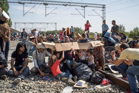 Migrants wait for trains at Tovarnik on the Croatian-Serbian border