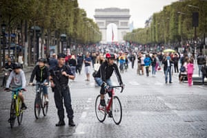 Pedestrians take to the street on the Champs-Élysées, free of its usual traffic