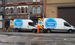 Two Thames Water vans attending an incident parked on a street