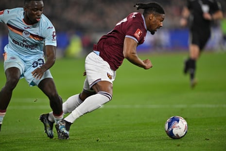 Adama Traore of West Ham United is brought down by Michael Kayode of Brentford FC for a West Ham penalty.