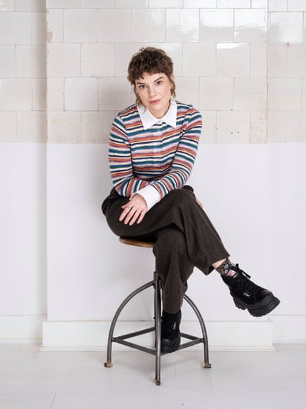 Edwards sitting on a stool.