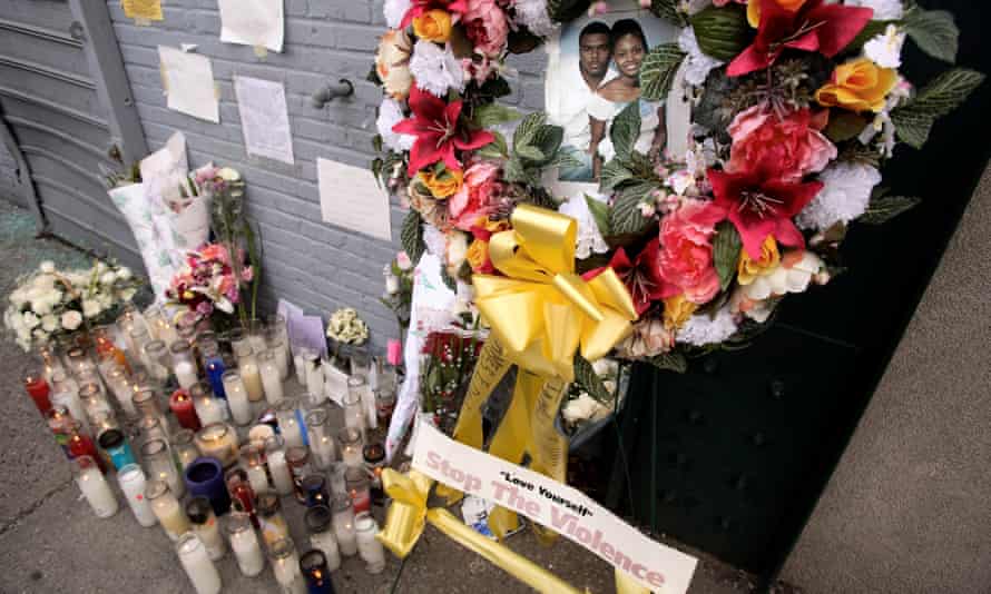 A photo of Sean Bell with Nicole Paultre Bell and one of his children at a candlelight memorial at the scene of his shooting in the Queens Borough of New York, November 29, 2006.