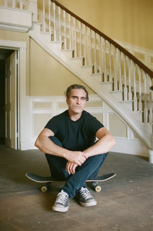 Joaquin Phoenix, 2019 “After chasing Joaquin down the warner brothers parking lot, him skating, me on a bike with 2 film cameras photographing him, we finally got a quiet and calm moment in this set house. I reloaded my film, be both took a deep breath, let our guard down and snapped this image.”