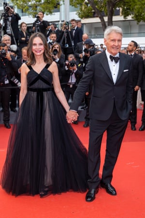 Both Calista Flockhart and Harrison Ford went for red carpet classics at the premiere of Indiana Jones And The Dial Of Destiny. Flockhart wore a LBD (long black dress) with velvet detailing, while Ford when for a simple tux with oversized dicky bow.