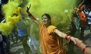 Supporters of the BJP celebrate a stunning election victory in Uttar Pradesh.