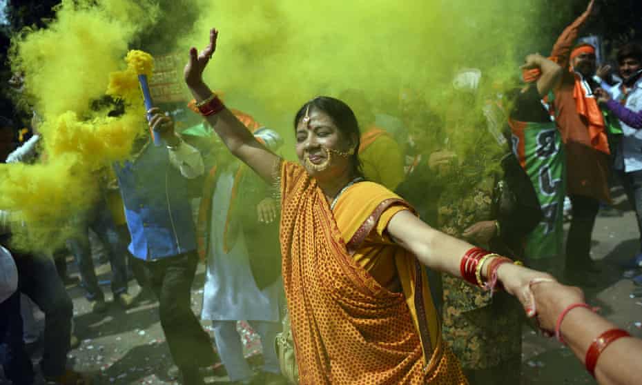 Supporters of the BJP celebrate a stunning election victory in Uttar Pradesh.
