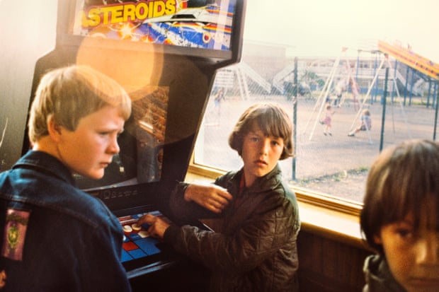Boys hanging in the amusement arcade at Butlin's holiday camp in Skegness in 1982.