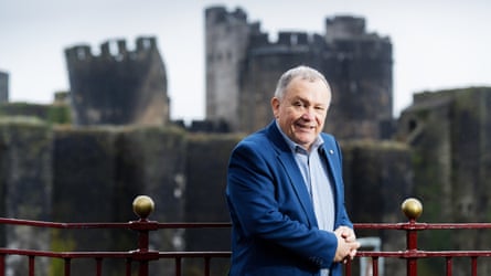 Lindsay Whittle smiling, with Caerphilly castle in the background