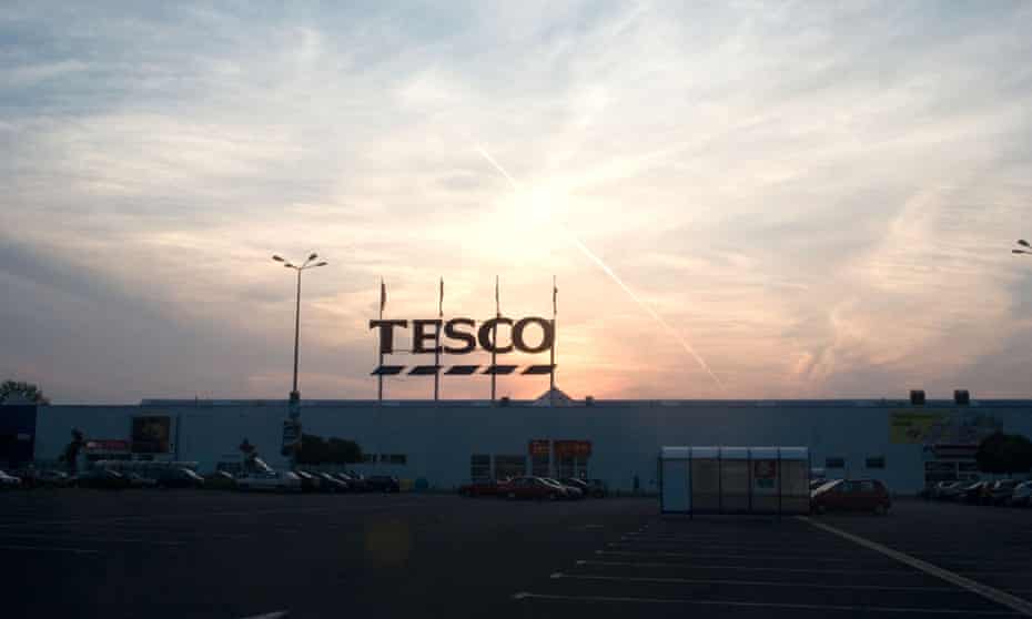 The sun sets on the Tesco store in Łódź, central Poland. 