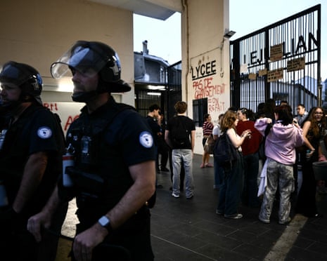 Police officers secure the area as students arrive to attend their classes at the Camille Jullian secondary school in Bordeaux, France.