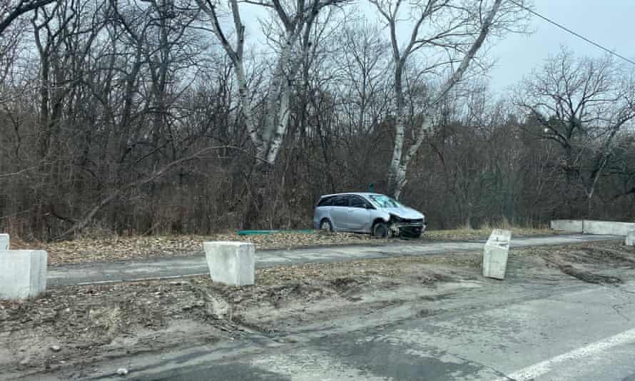 A crashed car on a street as Mike left Kyiv.