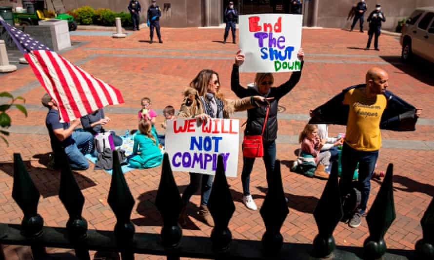 Protesters rally against stay-at-home orders related to the coronavirus pandemic outside Capitol Square in Richmond, Virginia.